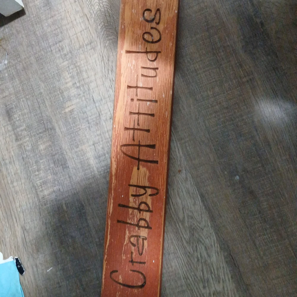Wooden Sign with Engraved Text